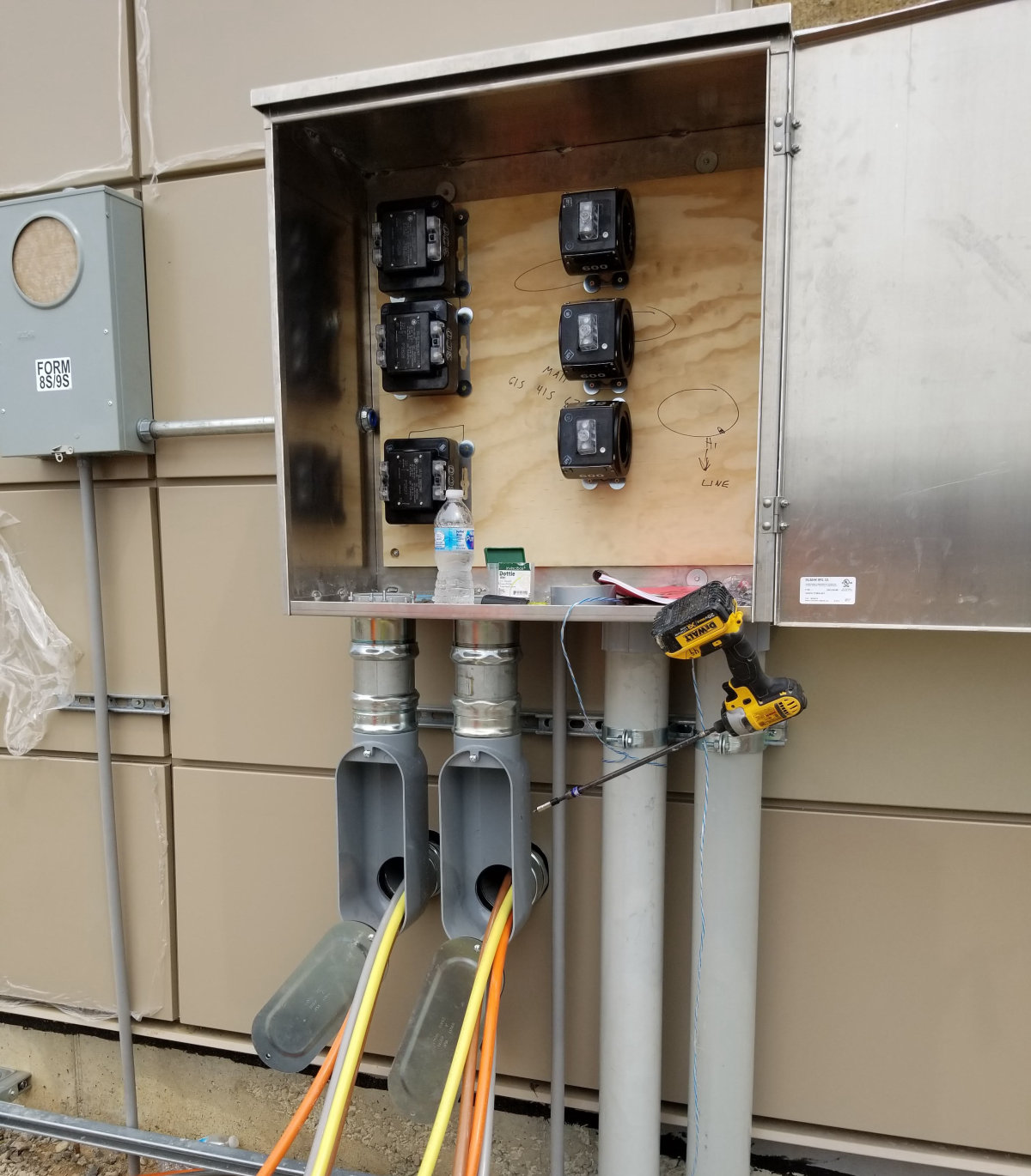 Stainless current transformer cabinet and metering wired during a commercial service upgrade by Amprite