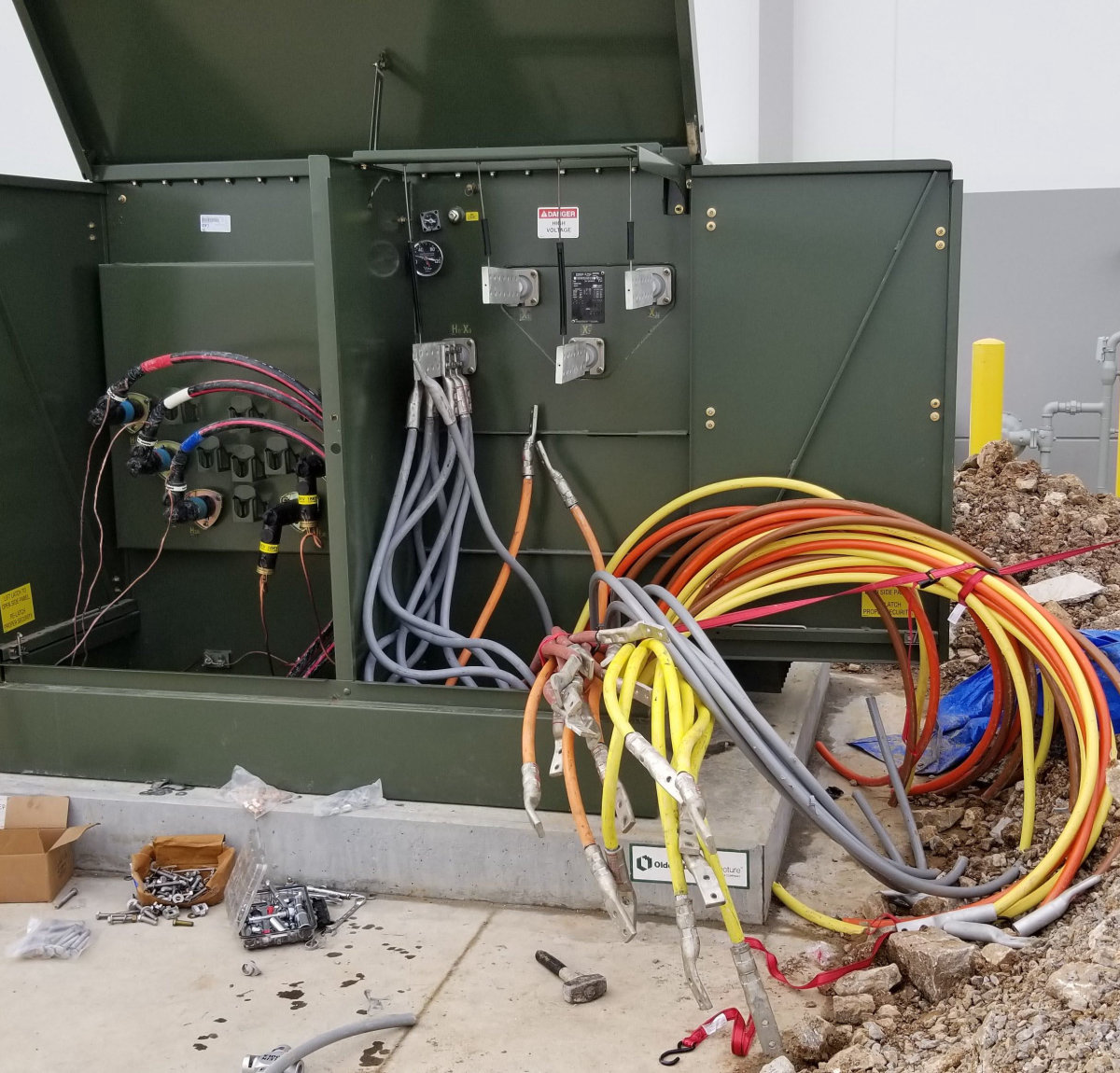 New pad-mounted electrical equipment being terminated by Amprite electricians