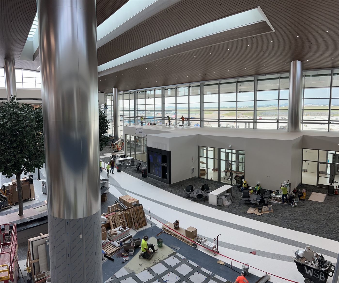 Amprite electricians installing lighting and electrical systems inside the Nashville International Airport (BNA) terminal
