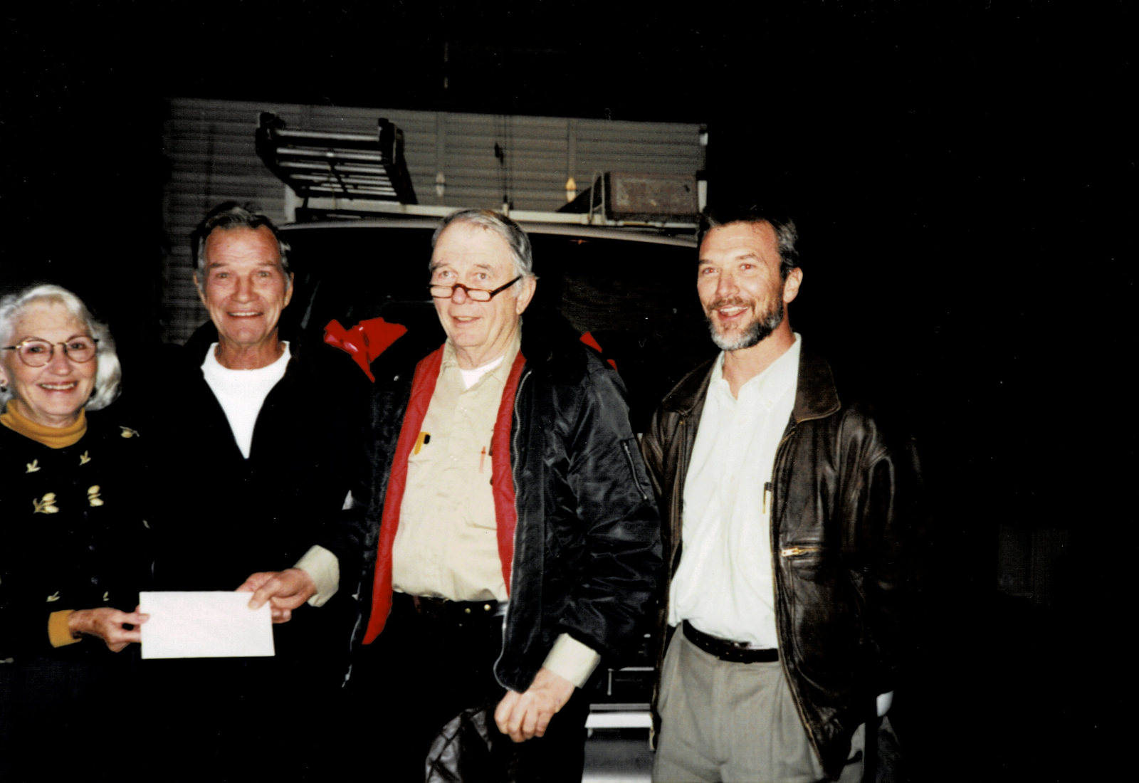 Eunice and Paul Pickney with key employee Ariel Elam and their son Mike Pickney, 1999