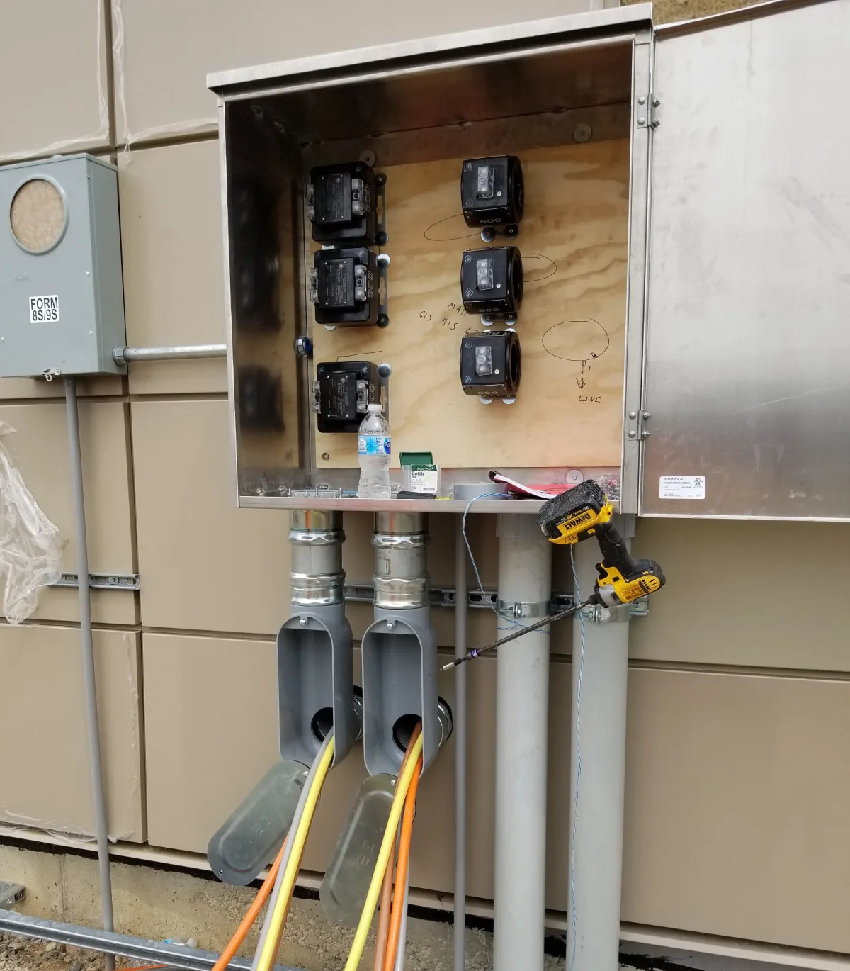 Stainless current transformer cabinet and metering wired during a commercial service upgrade by Amprite